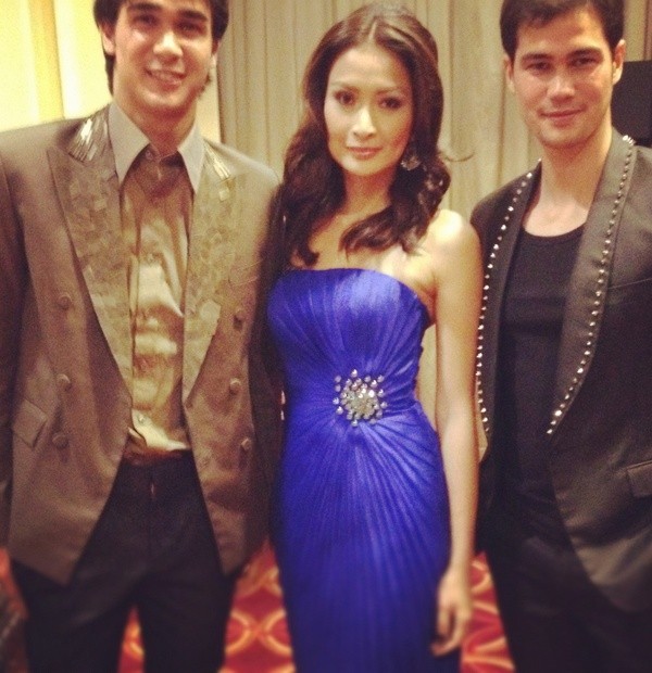 Phoemela Barranda in a pleated dress by Rhett Eala for vitostudio.com. She is with football heroes James and Phil Younghusband also in Rhett Eala.